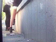 3 girls pissing nehind a van in public (secretly filmed)