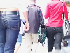A horny follows a hot bitch in tight jeans and heels