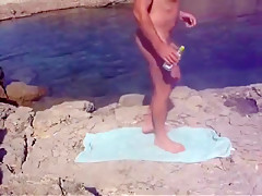 A hot day spent naked at the beach cums to a horny end