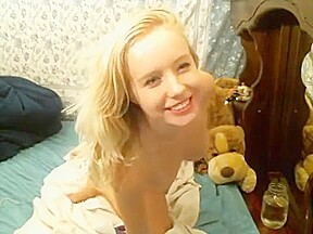 Adorable young blonde dildos herself