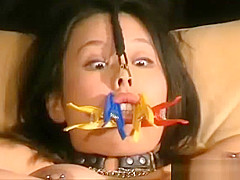 Amateur japanese in bizarre clothes pegs on her face