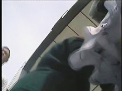 Amateur upskirt thong video of a tempting girl in fishnet