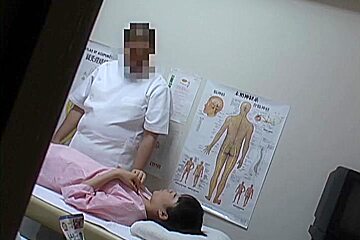 An Asian girl receives some good massage and pussy fingering in this medical tube
