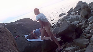 Anne in sex on the beach with a nice-looking babe