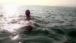 Anne in sex on the beach with a nice-looking babe