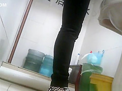 Asian girl in tight jeans pants peeing