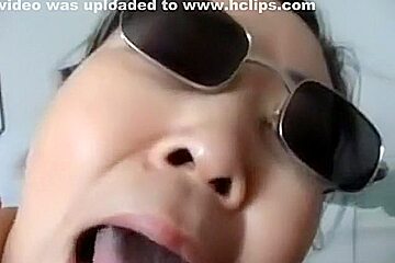 Asian girl with sunglasses sucks cock, while getting fingered 