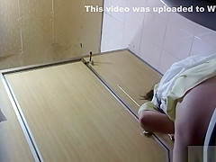 Asian lifts her skirt and take a pee