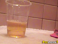 Asian teen 18+ Urinates In Plastic Glass