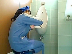 Asian toilet attendant cleans wrong part1