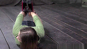 BDSM bounded submissive on floor hogtied
