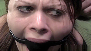 BDSM bounded submissive on floor hogtied