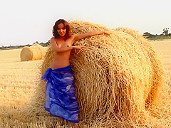 Beautifl girl goes naked in fields wandering nude in nature outdoors