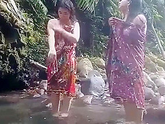 Beautiful girls having bath outdoor