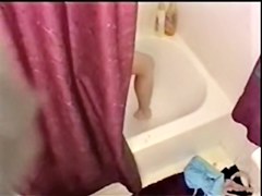 Big titted brunette stripping and showering on