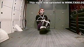 Blonde girl wrap gagged in a van