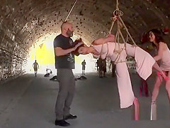 Brunette beauty suspended and whipped outdoor