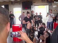 Brunette serves bikers in shop