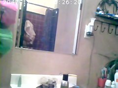 Brunette showing Tits in Bathroom