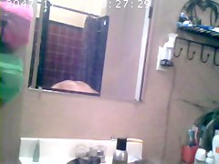 Brunette showing Tits in Bathroom