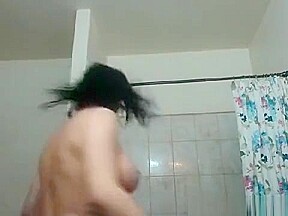 Brunette with glasses puts a dildo depply in her pussy