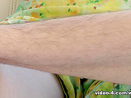 Camille undresses on white sofa to show hairy body