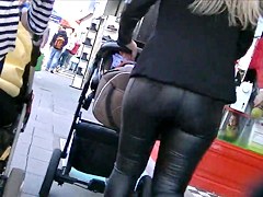 Candid ass in shiny tight leather pants