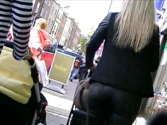 Candid ass in shiny tight leather pants