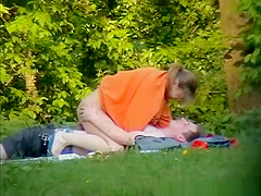 Chick rides dick in public park
