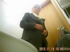 Classy blonde mature urinates in public bathroom video