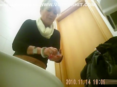 Classy blonde mature urinates in public bathroom video