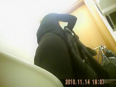 Classy blonde mature urinates in public bathroom video