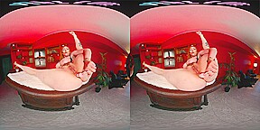 Curvy redhead shoves a toy up her ass in virtual reality