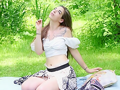 Cute Hippie Smoking And Toying On A Trail