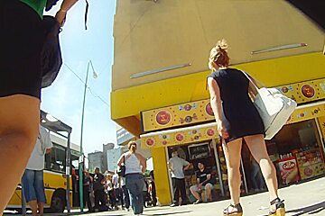 Delicious blonde babes walks sexy in upskirt video