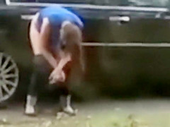 Desperate babe pees on a public suburban street