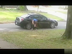 Desperate babe pees on a public suburban street