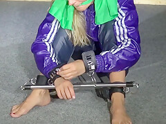Get 2 Archive Videos With Sandra Enjoying Bondage In Her Shiny Nylon Rainwear