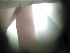 Girl in dressing room bares off and shakes the butt