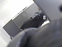 Girl with long legs tries on dress in the changing room