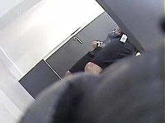 Girl with long legs tries on dress in the changing room