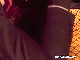 Gorgeous, black haired woman is wearing a lacy mask on her face while sucking a fat dick