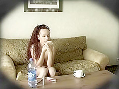 Gorgeous young chick loves to put on her makeup while in th