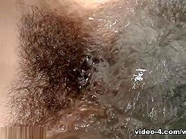 Hairy girl Veronica Snow goes swimming in her pool