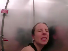 Horny brunette with a guy in the shower
