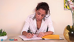 Hot secretary Mayla places her nyloned feet on the office desk