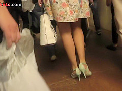 Hot upskirt porn with auburn-hair gal in a public place