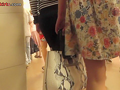 Hot upskirt porn with auburn-hair gal in a public place