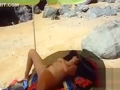 I caught a nudist woman masturbating on the beach