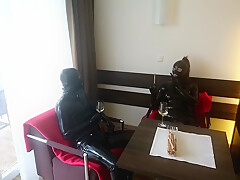 In Latex Covered Couple Enjoys A Good Drink